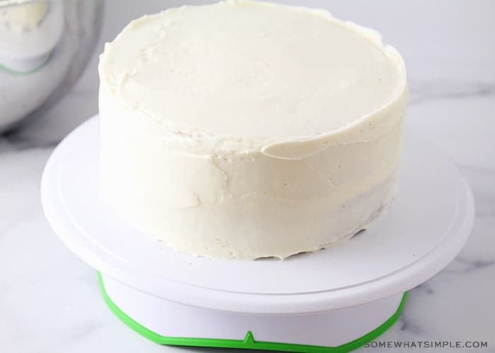 a carrot cake covered in white icing