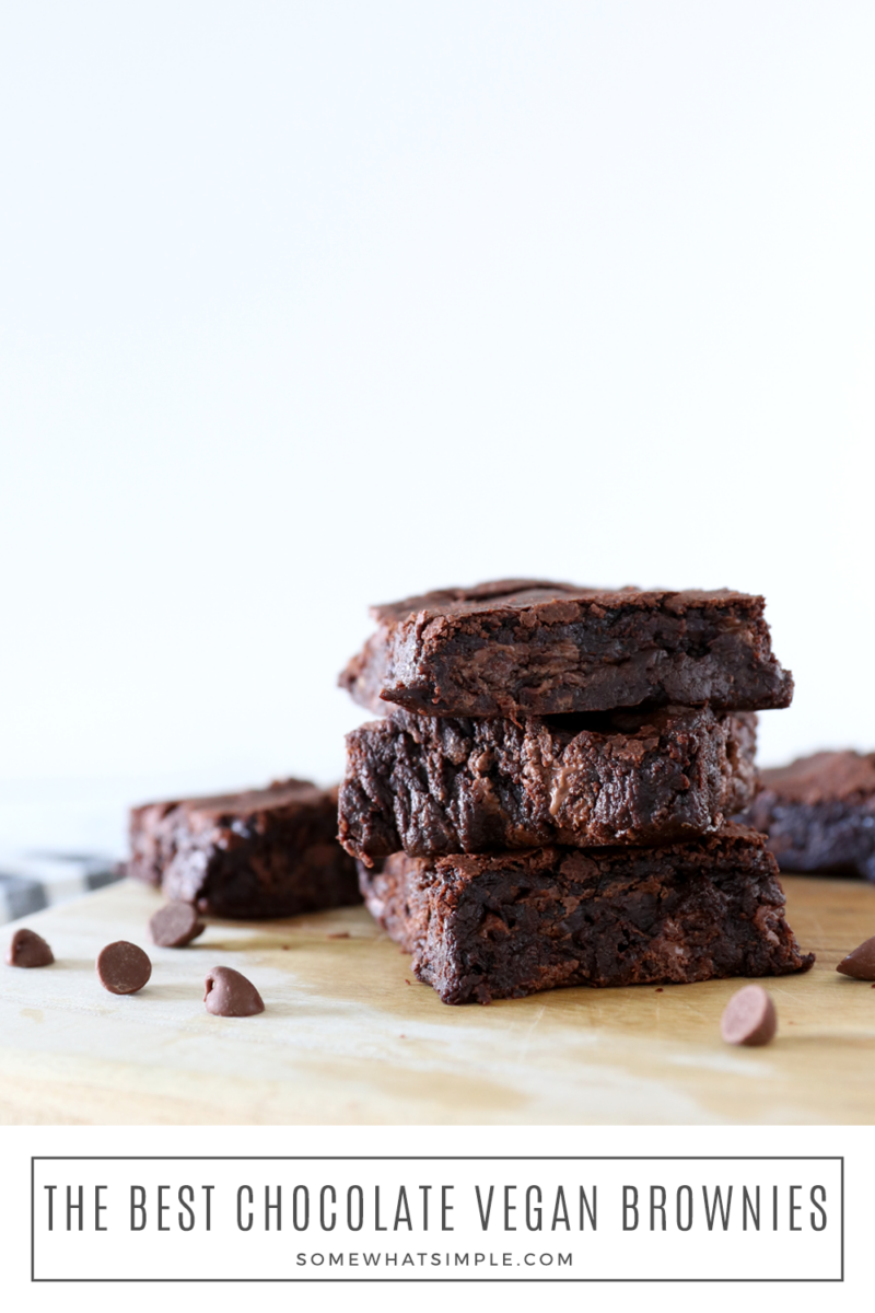 stack of chocolate brownies on a brown cutting board