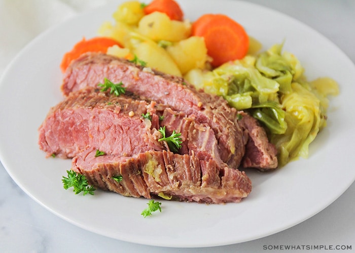 a plate of corned beef and cabbage