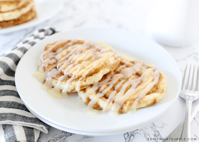 Cinnamon Roll Pancakes on a white plate 