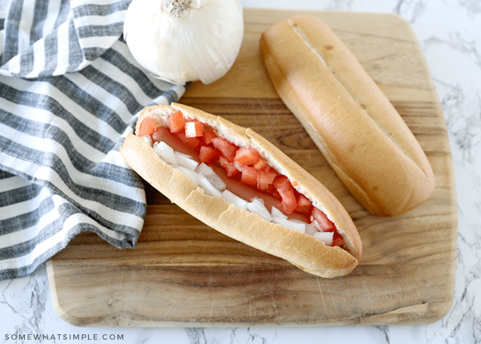 hot dog with onions and tomatos