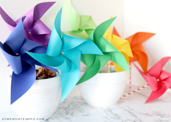 colorful paper pinwheels in bowls on the counter