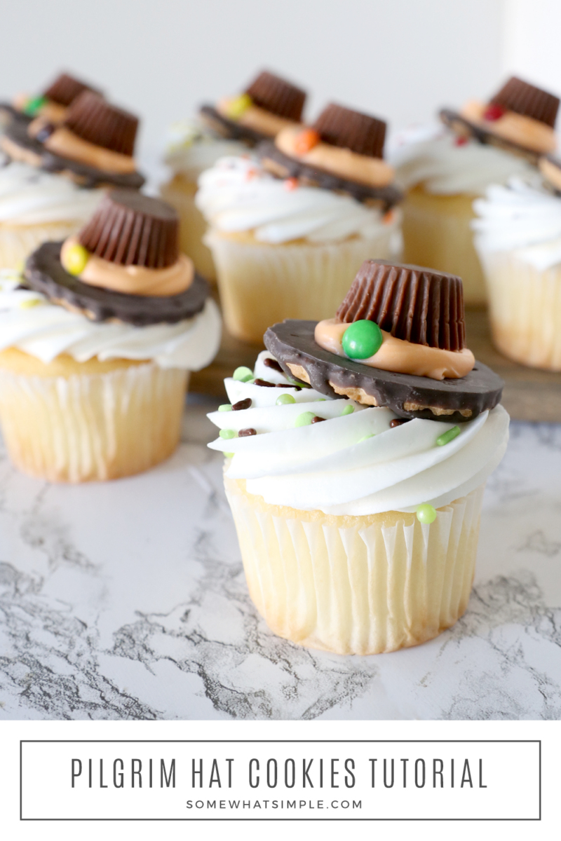 several pilgrim hat cupcakes on a white counter