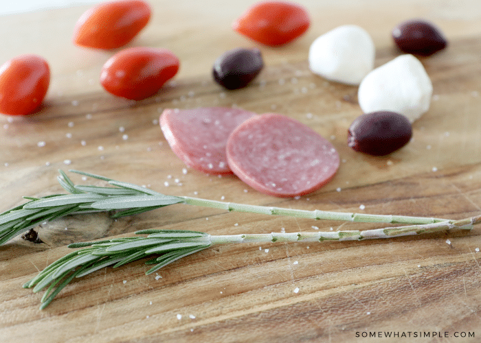 caprese skewers ingredients on a cutting board