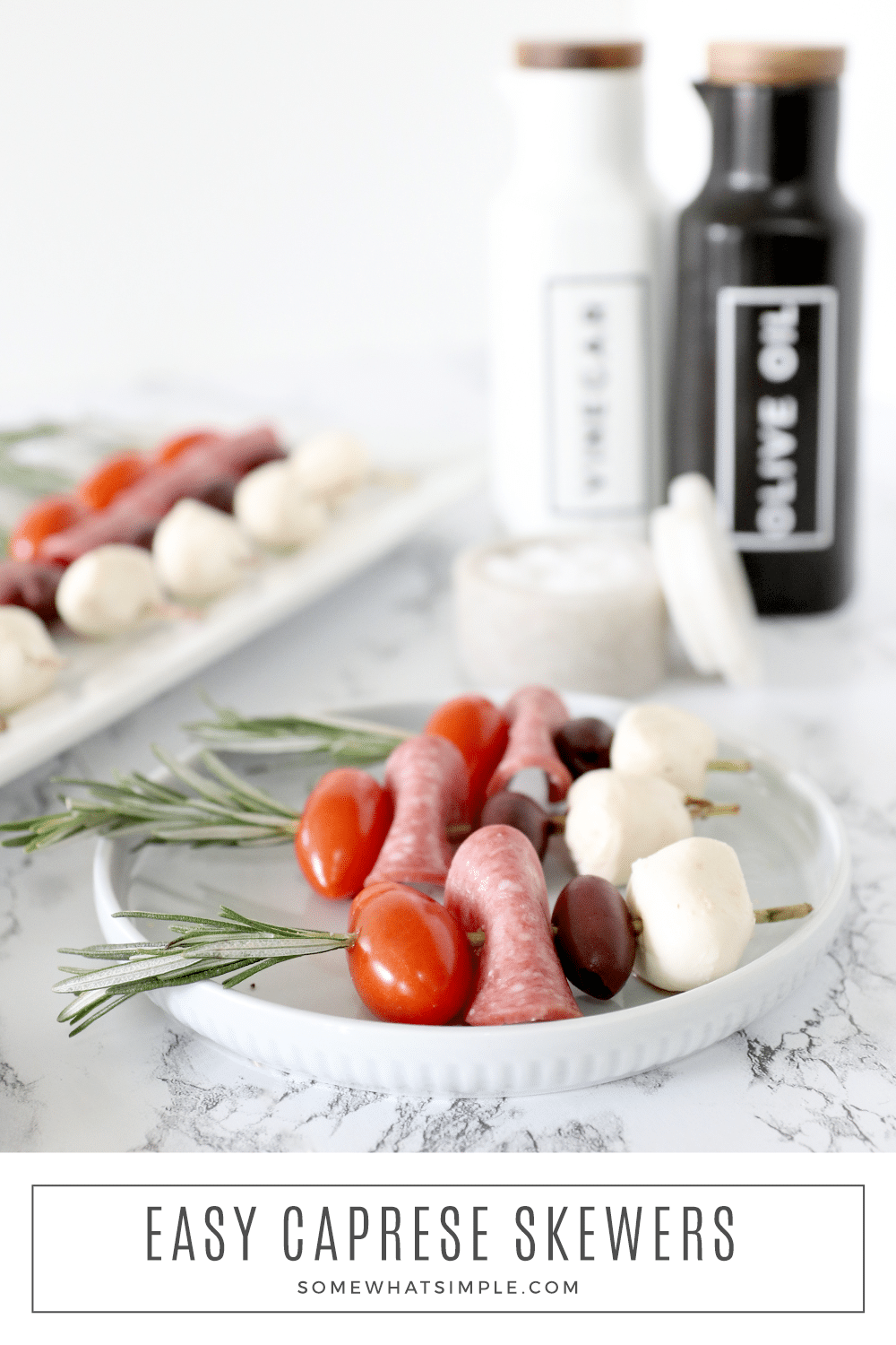 Rosemary Caprese Skewers are simple to put together and taste delicious! They're impressive appetizers that look fancy without the fuss! via @somewhatsimple
