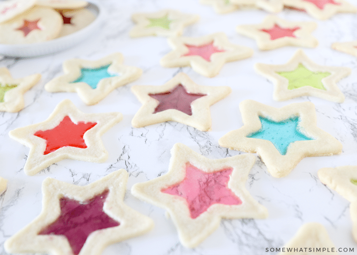 stained glass cookies in a variety of colors on the counter