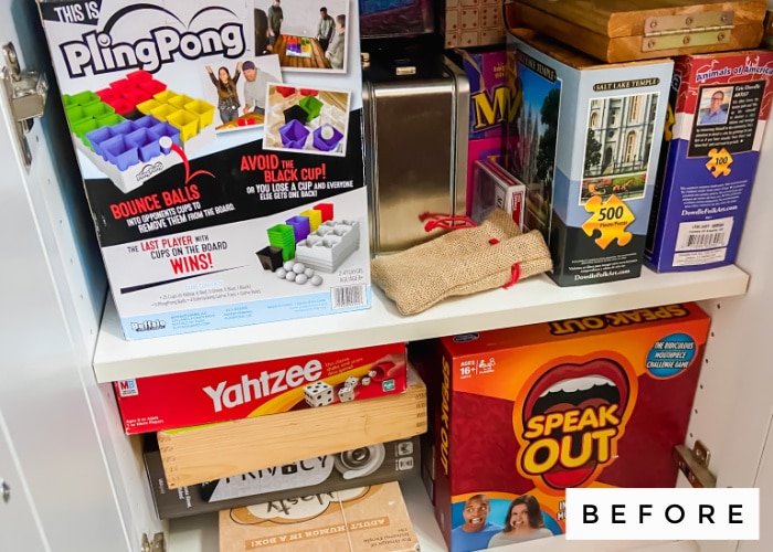 game cupboard with boxes over-flowing