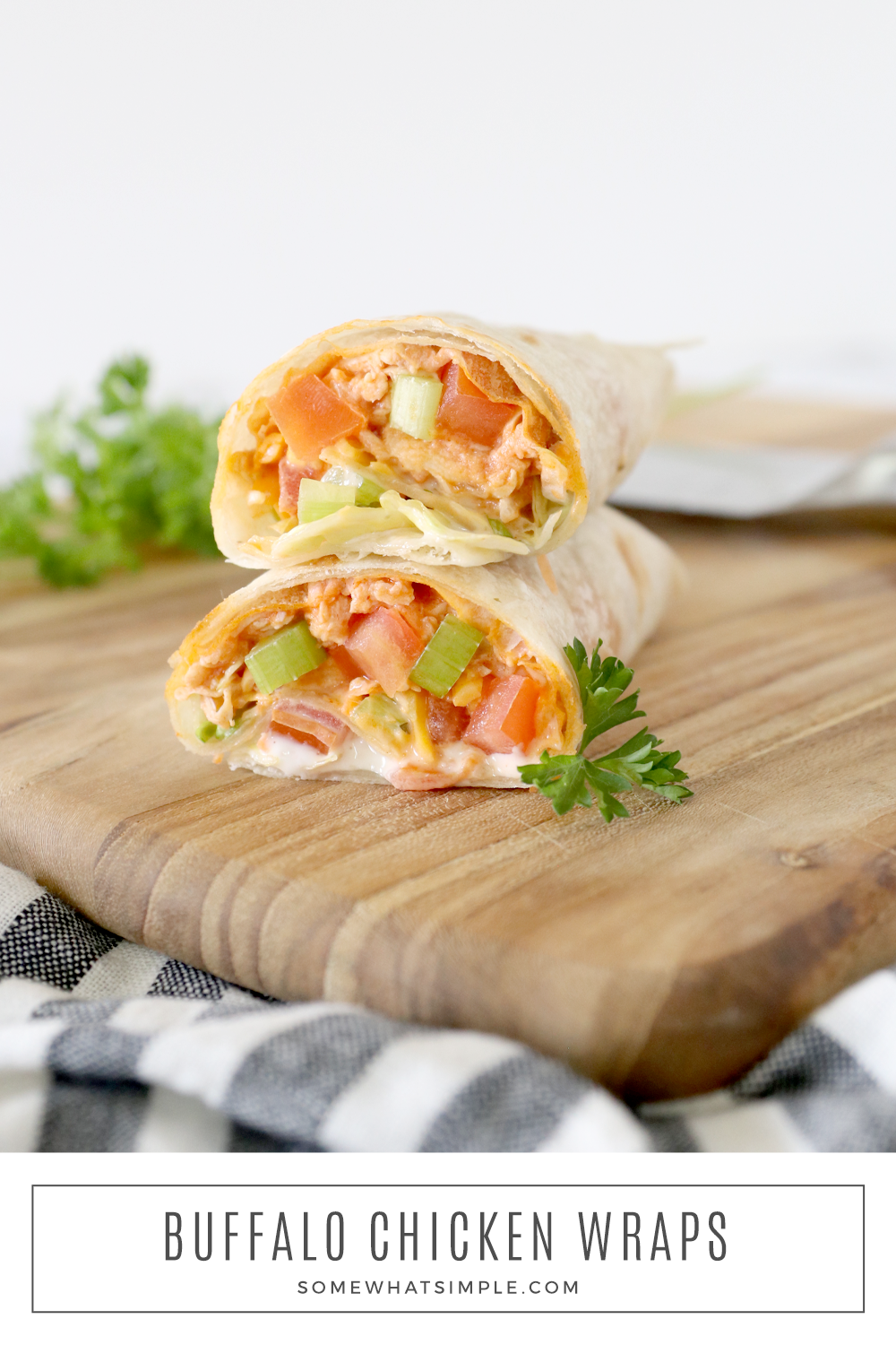 Buffalo Chicken Wraps are stuffed with zesty buffalo chicken, crunchy vegetables, shredded cheese, and ranch dressing. They're creamy, totally delicious, and they can be made in 5 minutes or less! via @somewhatsimple