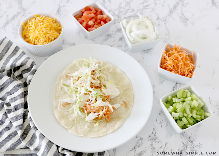 tortilla being filled with toppings