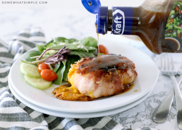 pouring dressing on top of chicken breast