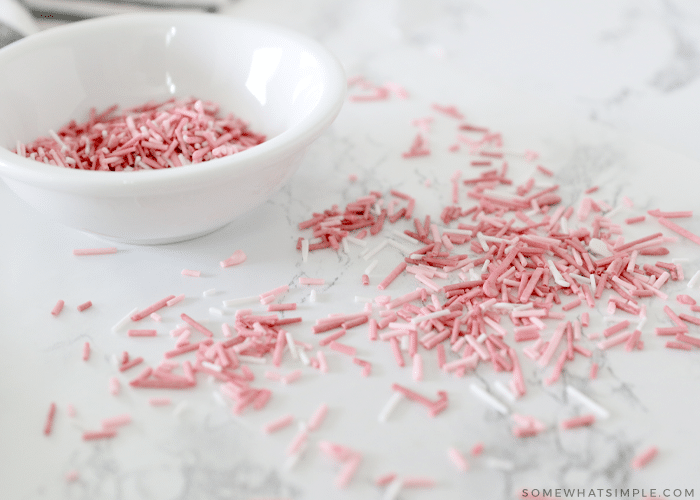 homemade pink sprinkles on a white counter