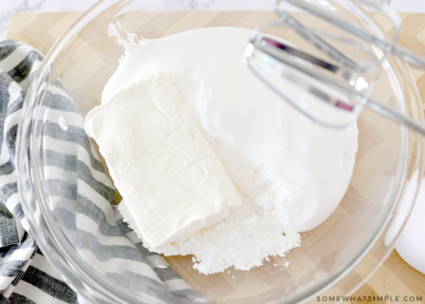 mixing cream cheese, powdered sugar and marshmallow fluff