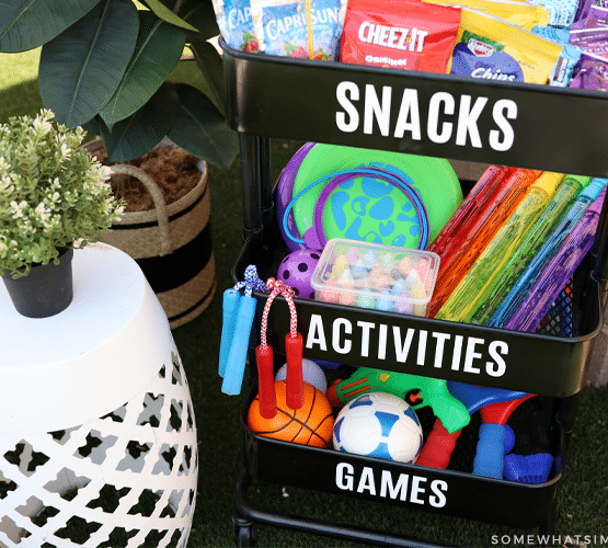 portable cart with toys and snacks for an outdoor play station