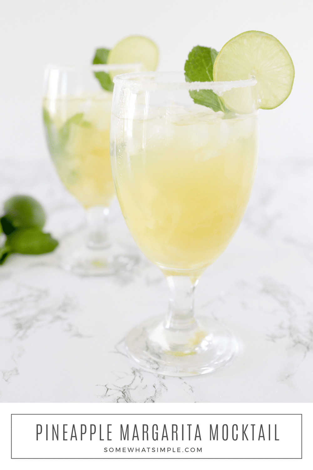 This non-alcoholic Pineapple Margarita Mocktail is a deliciously refreshing drink that the whole family can enjoy! The fruity blend is both sweet and tart, and it happens to be super simple to make! via @somewhatsimple