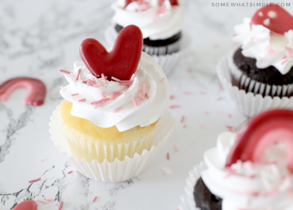 decorated cupcakes with hearts and sprinkles