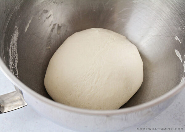 bread dough in a mixing bowl