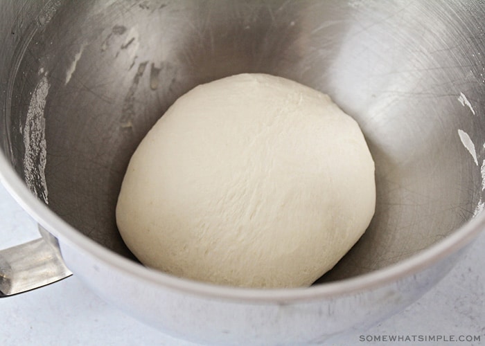 ball of pretzel dough in a mixing bowl