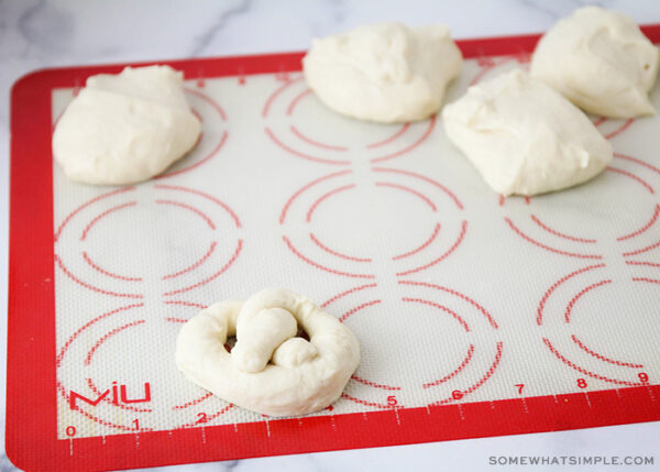 pretzel dough on a baking mat