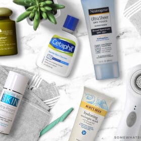 favorite face products laid out on a white counter