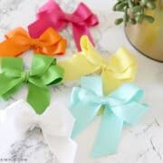 6 colors of hair bows laying on the counter