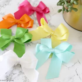 6 colors of hair bows laying on the counter