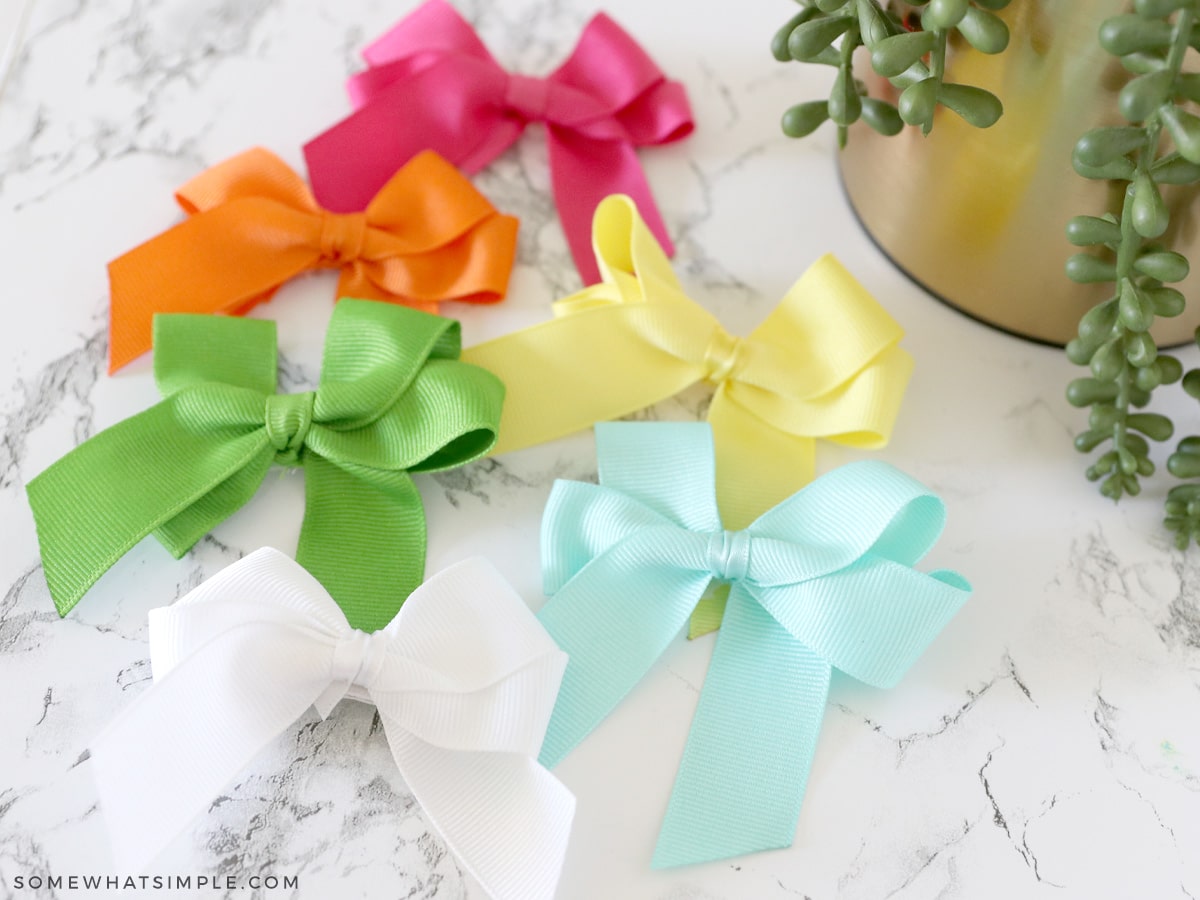 6 colors of hair bows laying on the counter