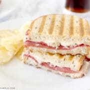 reuben sandwich on a white plate