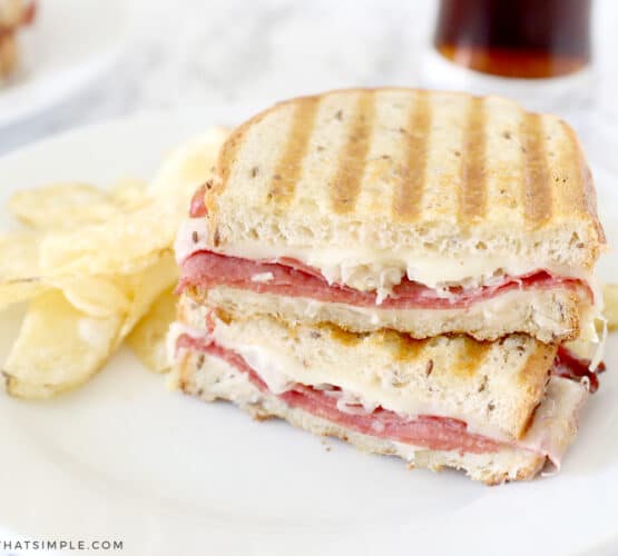 reuben sandwich on a white plate