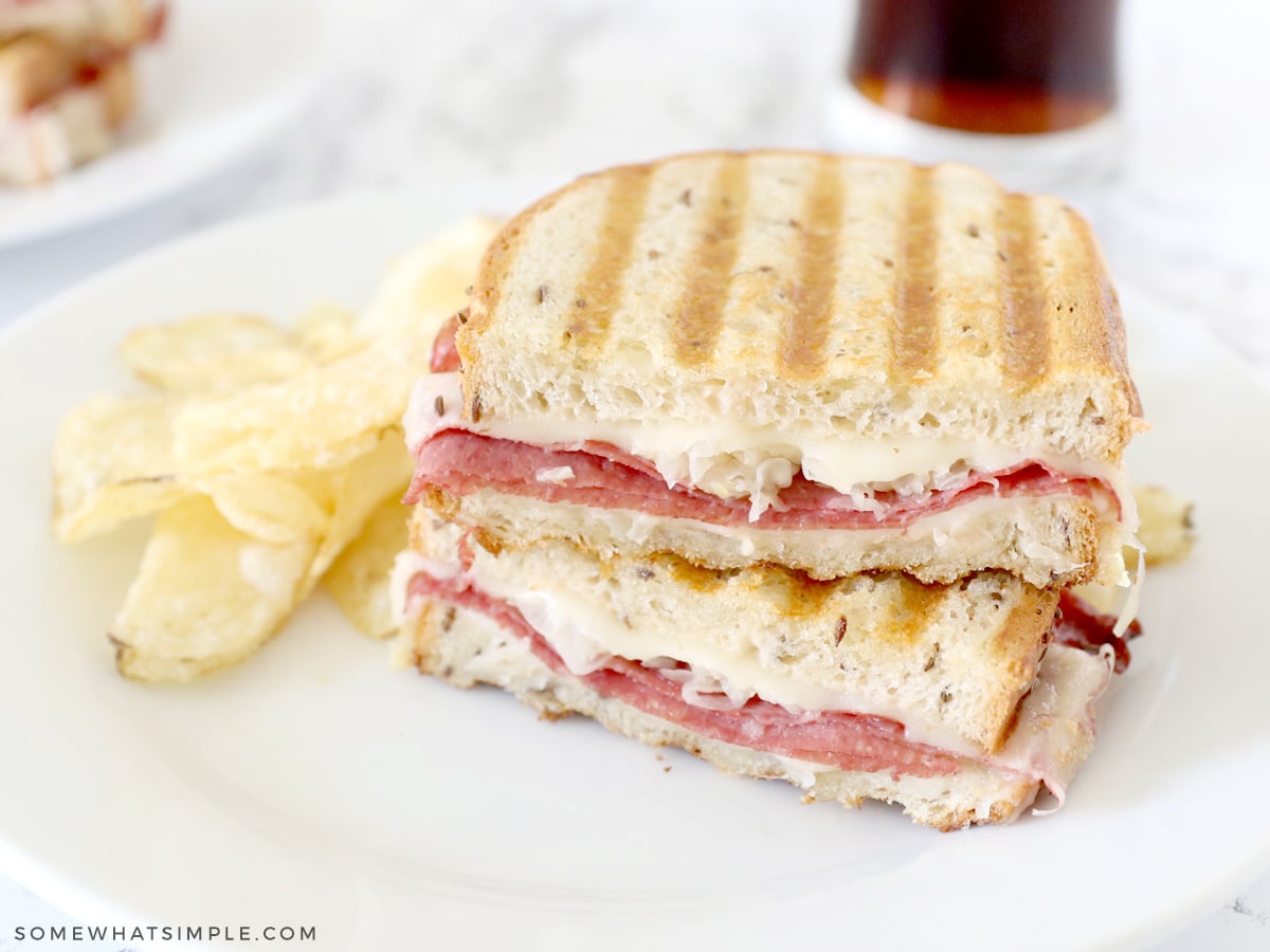 reuben sandwich on a white plate