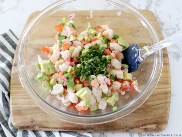 mixing a shrimp avocado salad