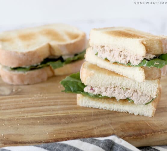 tuna salad sandwich cut in half and stacked on top of each other