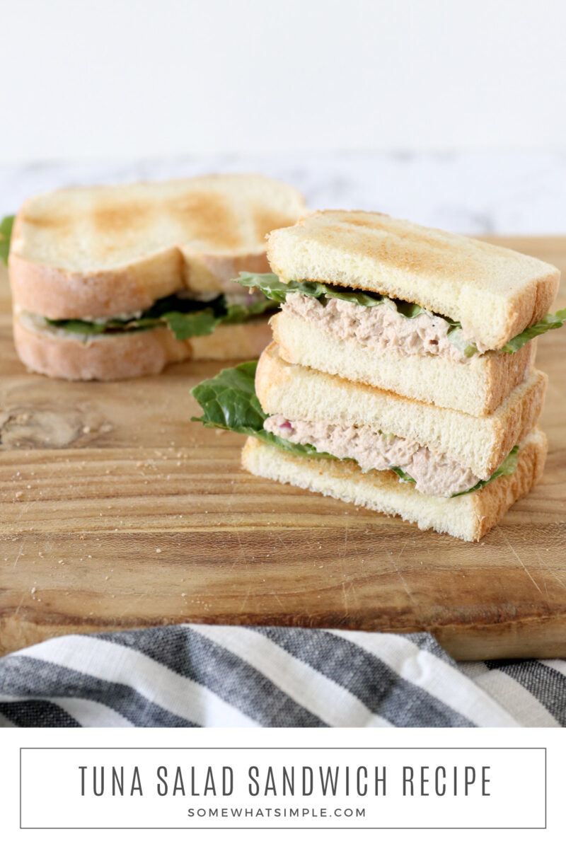 tuna salad sandwich on a wood cutting board