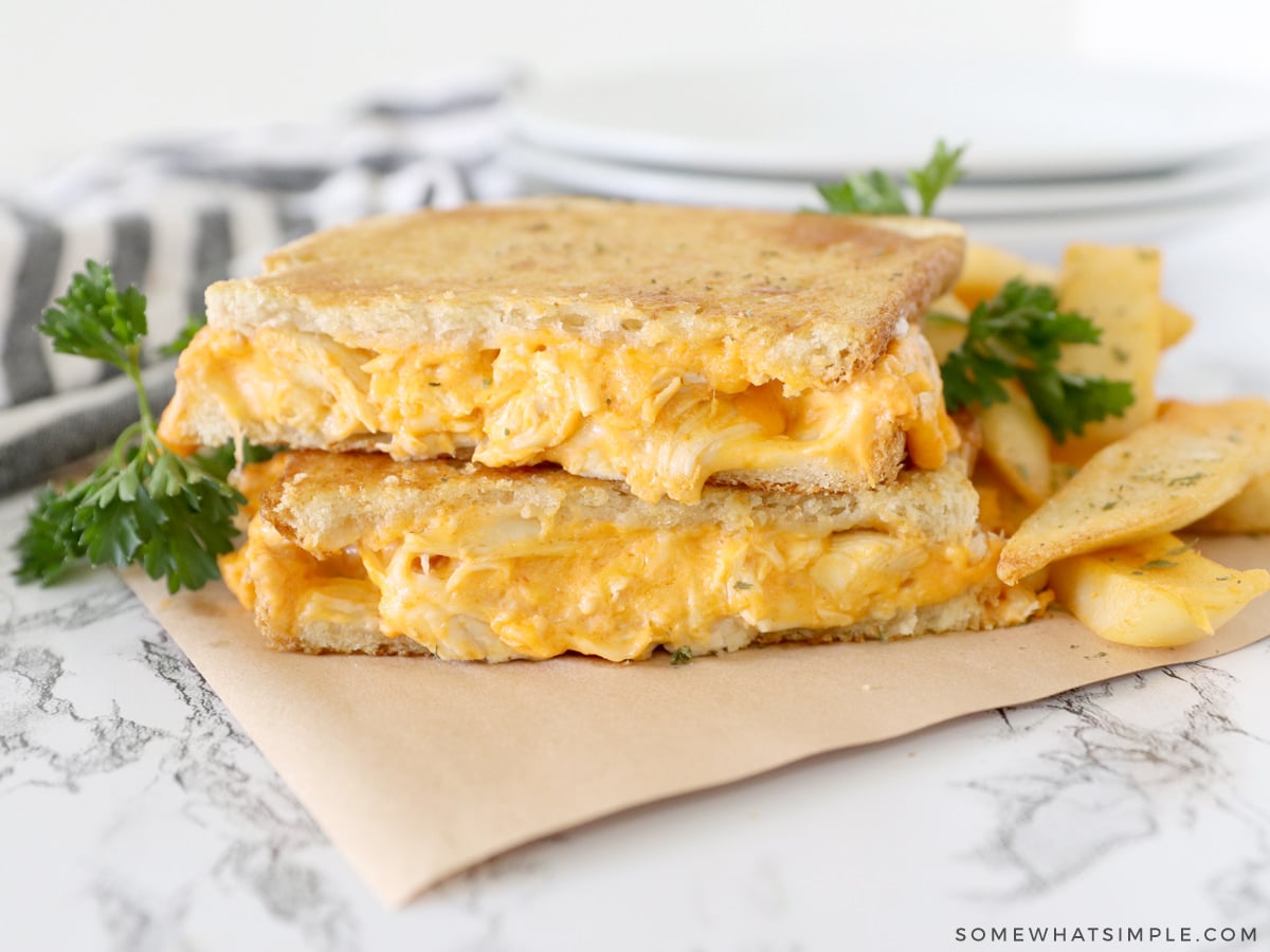 buffalo chicken sandwich cut in half and stacked on top of each other