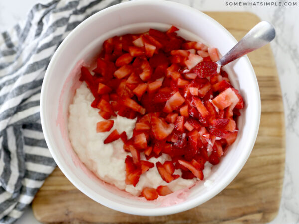 adding cottage cheese and strawberries to jello