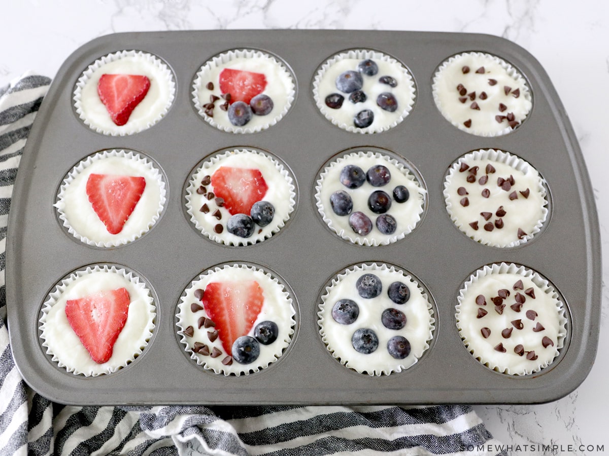 muffin tins with granola + yogurt cups topped with fruit