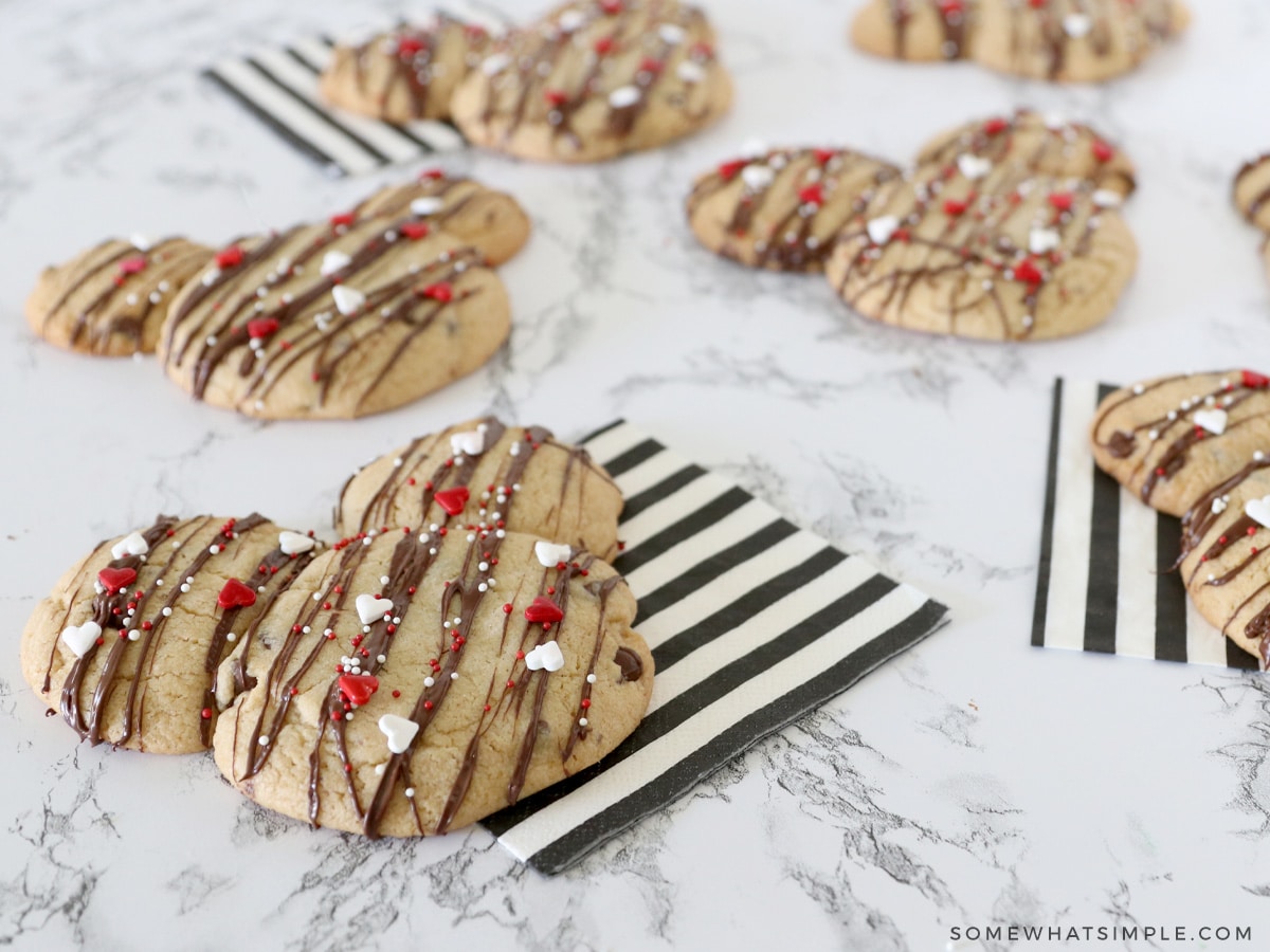 multiple mickey mouse cookies laying on the counter