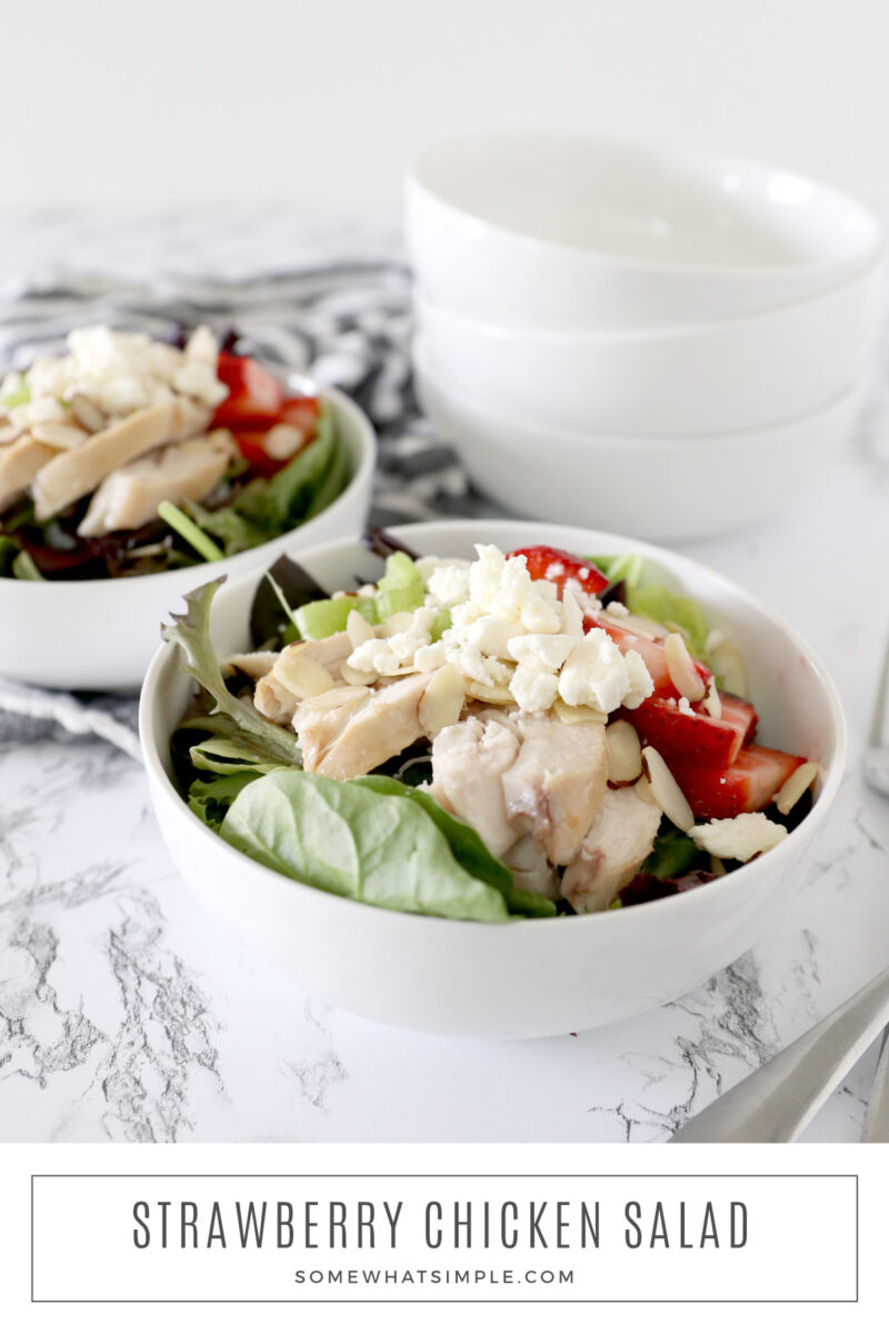 long image of two bowls filled with strawberry chicken salad