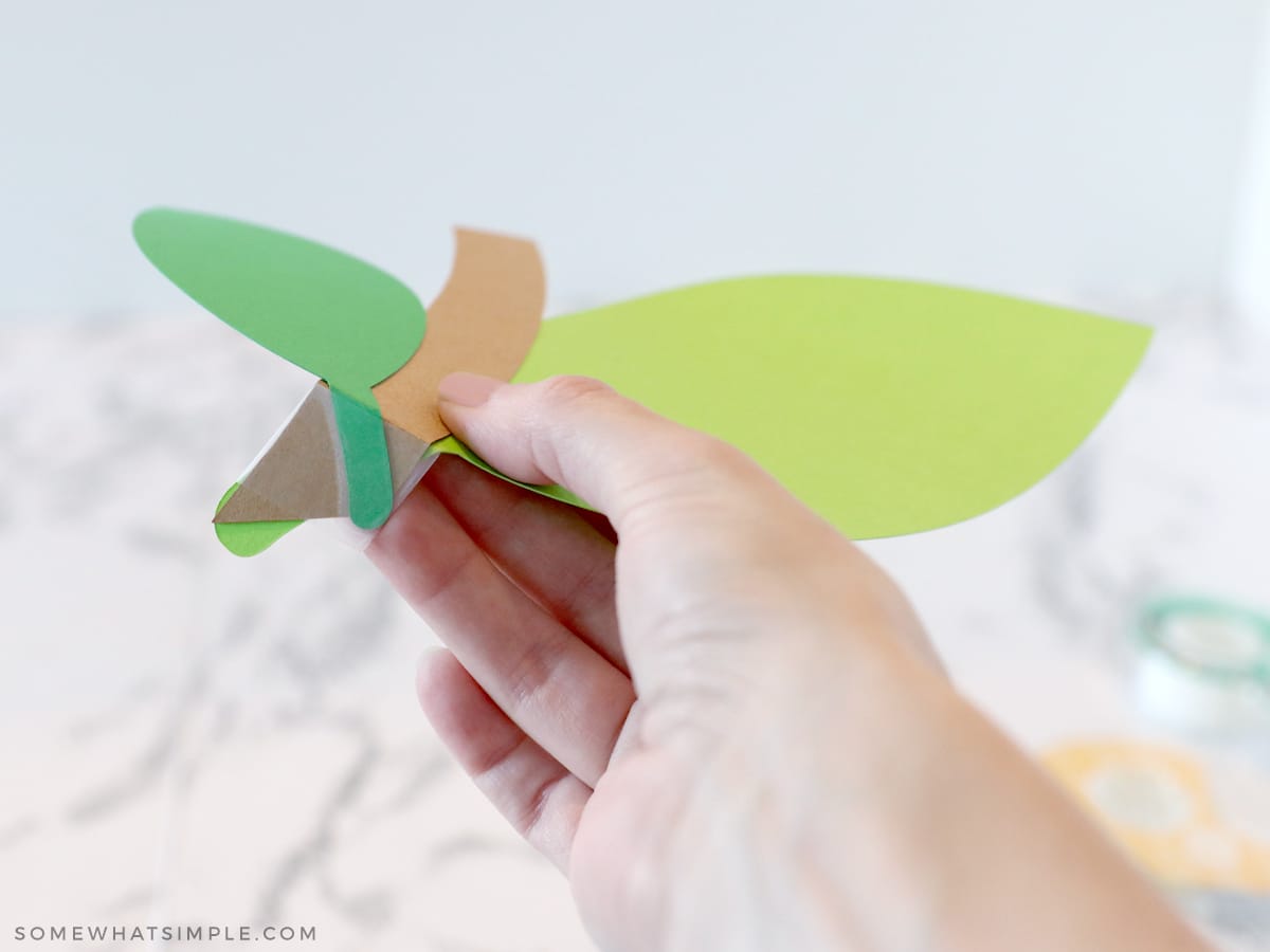 taping paper stems and leaves together