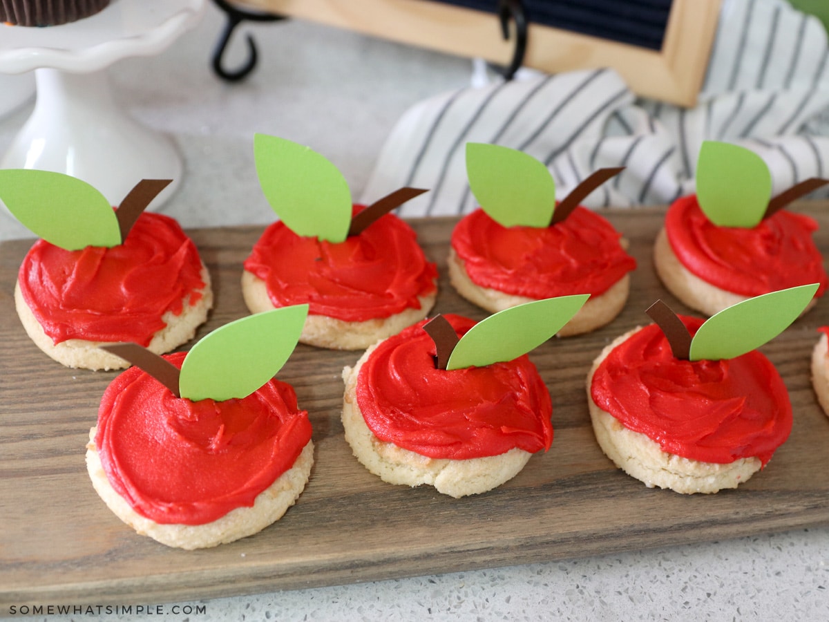 paper leaves and stems on a red cookie