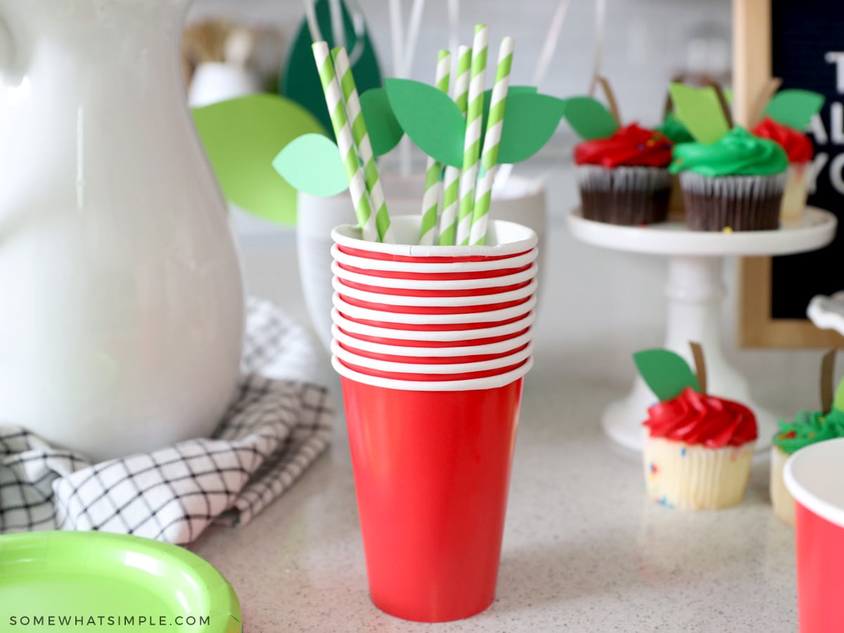 green paper leaves on green paper straws