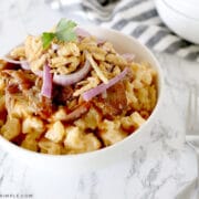 brisket mac and cheese in a white bowl