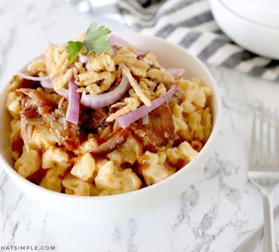 brisket mac and cheese in a white bowl