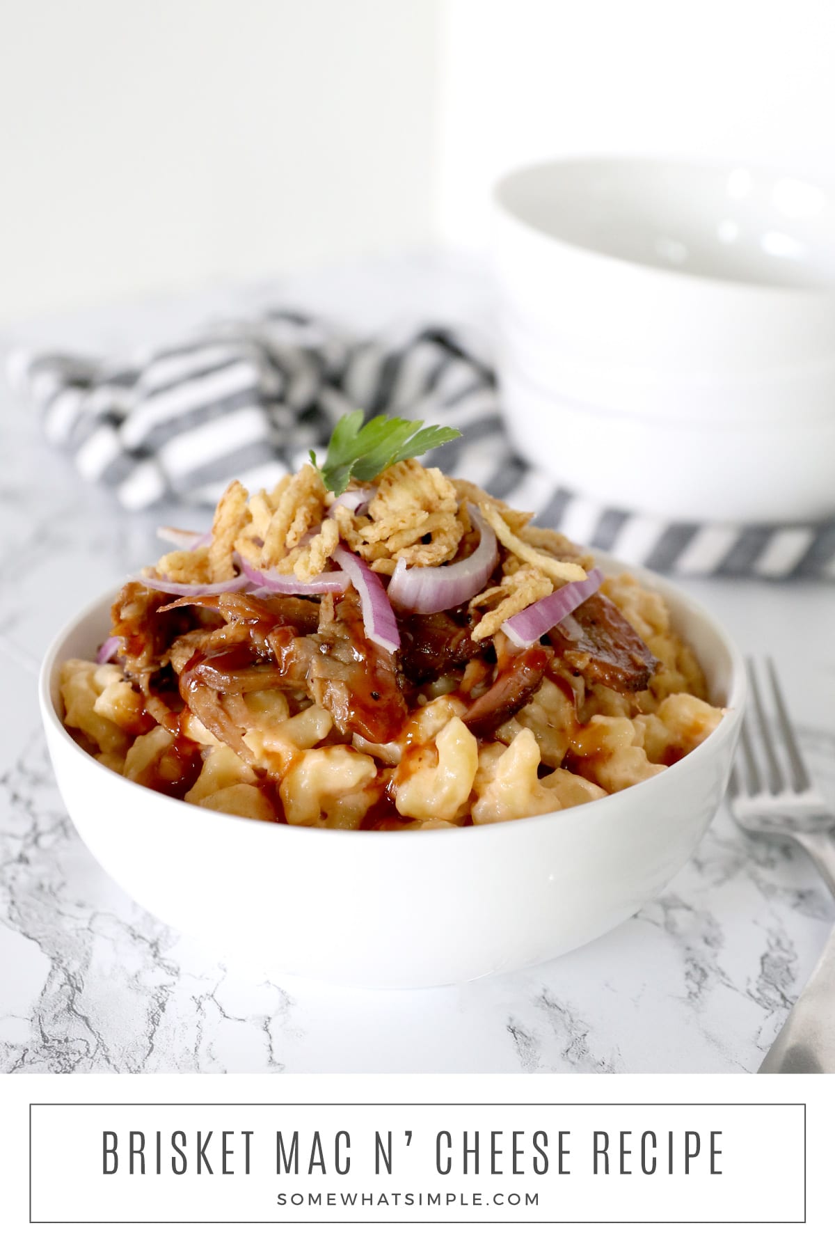 Creamy, cheesy macaroni topped with barbecue brisket, and crispy french fried onions - this Brisket Mac and Cheese recipe is a delicious crowd-pleaser! via @somewhatsimple