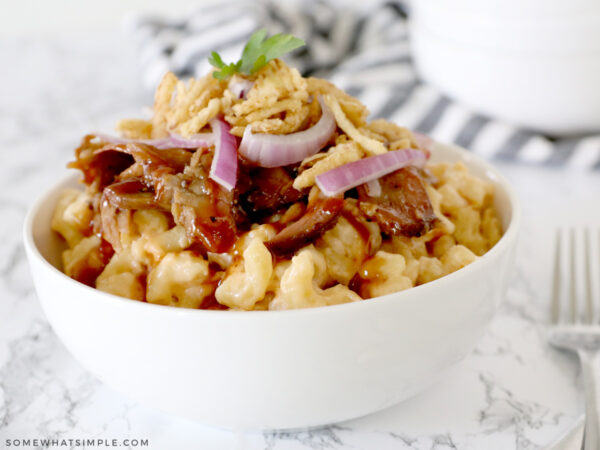 brisket mac and cheese in a white bowl