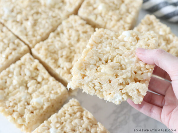 holding a rice krispie treat