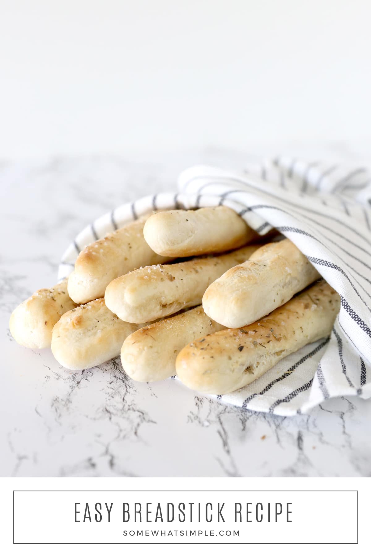 Soft homemade breadsticks are made with just 5 ingredients and take less than 20 minutes to make! They're super simple and totally delicious! via @somewhatsimple