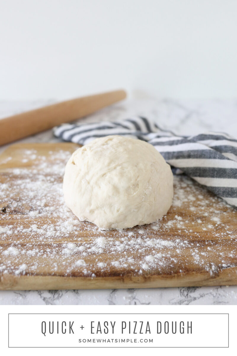 long image of pizza dough on a cutting board