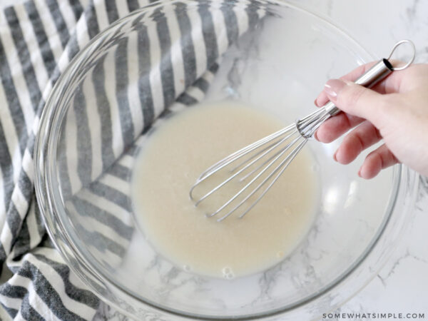 whisk water, sugar and yeast in a glass bowl