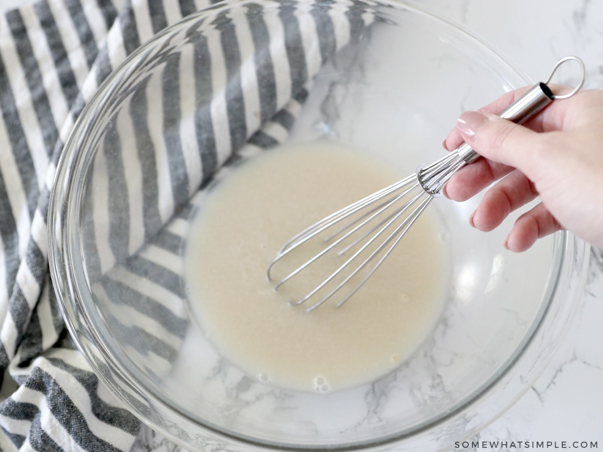 whisk water, sugar and yeast in a glass bowl