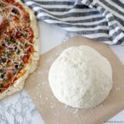 ball of dough next to a pizza